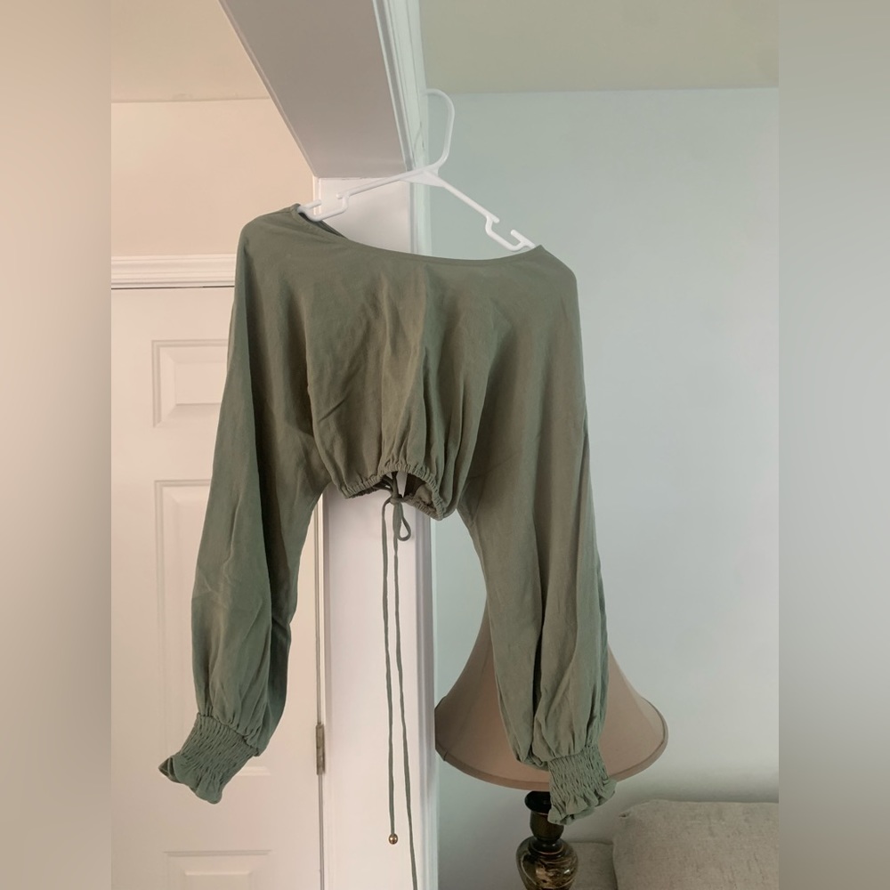 green cropped long sleeve top
